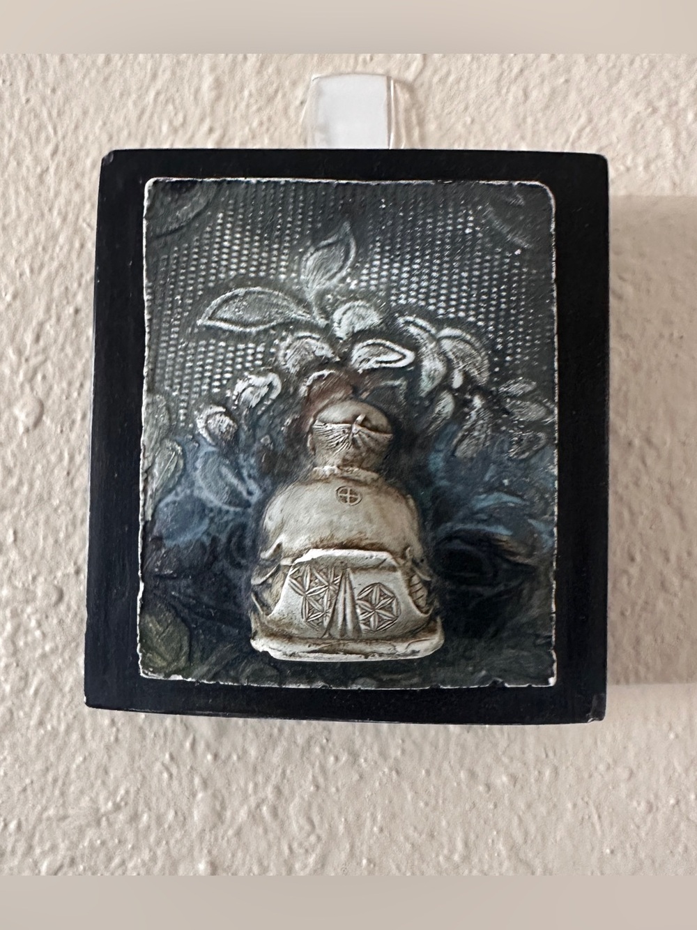 R. Skipper Signed Repoussé Relief — Seated Figure with Sacred Bundle 4X4”